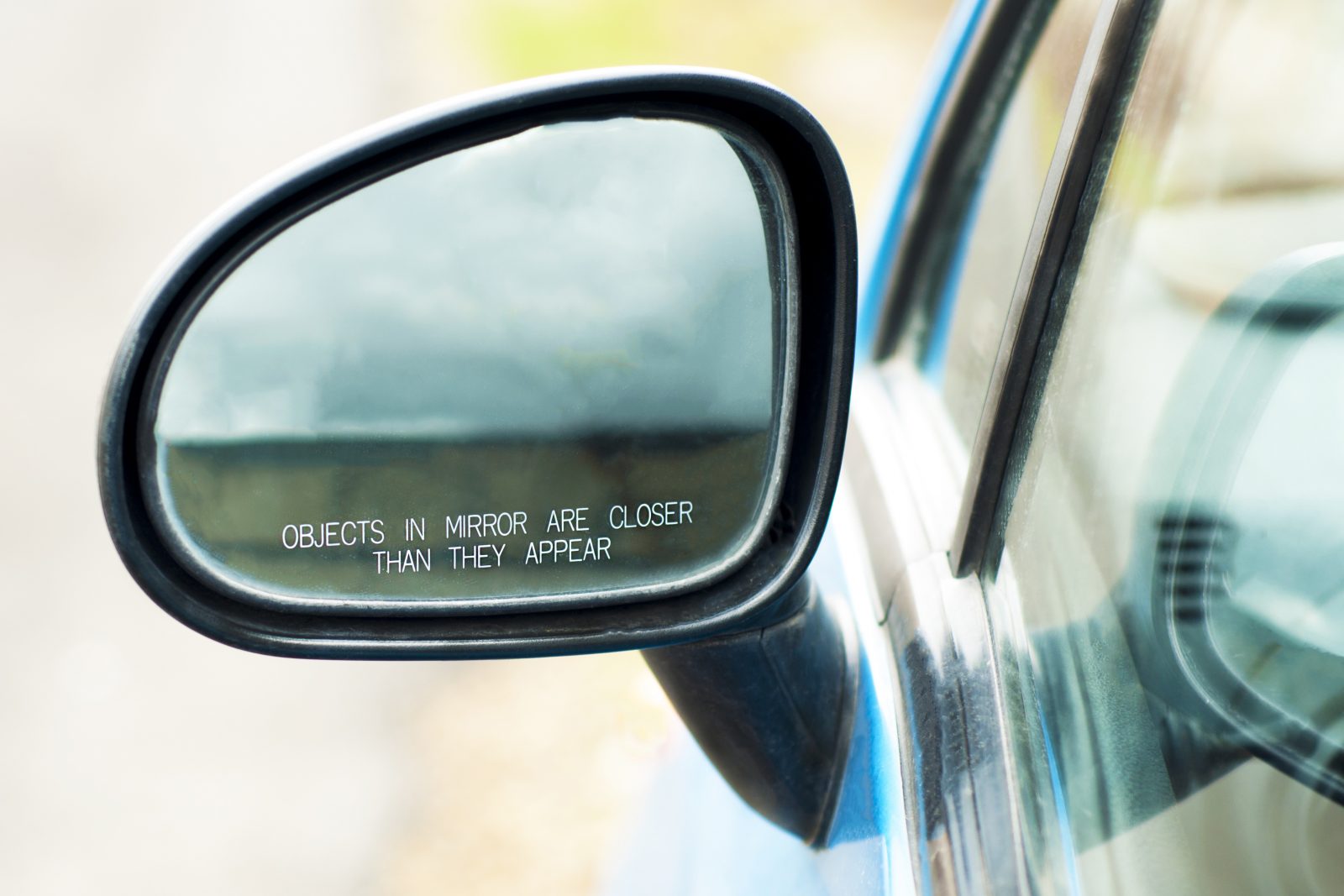 The inscription on the car side mirror: 