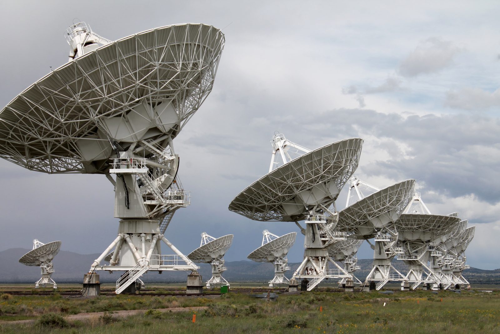 The Very Large Array (VLA) radio-astronomy antennas, in New Mexico, is one of the most impressive observatories in the world. The Sun was piercing through after a major storm during a public tour.